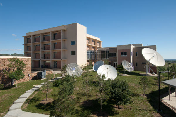 Satellites in front of building