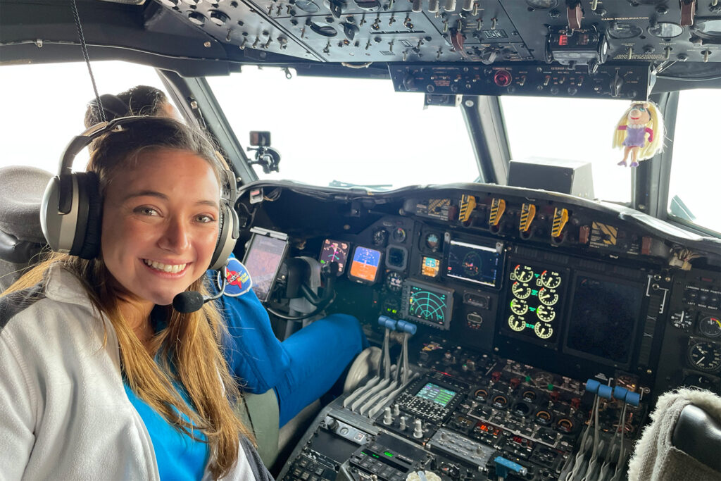 Angelie Nieves Jiménez in the cockpit of “Miss Piggy,” a NOAA WP-3D Orion aircraft designed to fly into hurricanes.